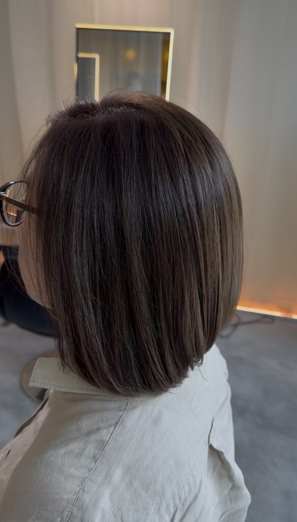 Glossy ash brown hair color with fine highlights on a Japanese bob, low-maintenance dimensional color at Colors Japanese Hair Salon Singapore near Clarke Quay MRT, Chinatown, Havelock Road