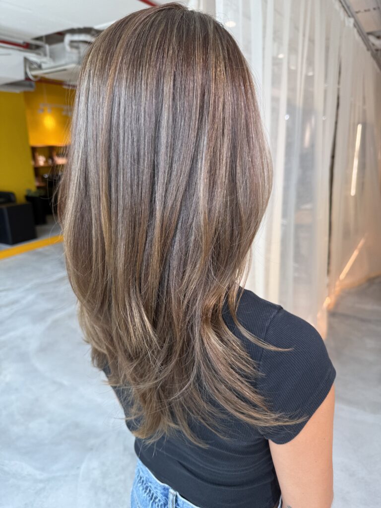 Soft grey blending highlights with natural dimension on layered hair at Colors Japanese Hair Salon Singapore near Clarke Quay MRT and Chinatown