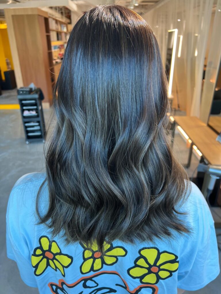 Plex color with fine highlights on long layered hair at Colors Japanese Hair Salon Singapore, soft ash tone for Asian hair with added shine and volume near Clarke Quay