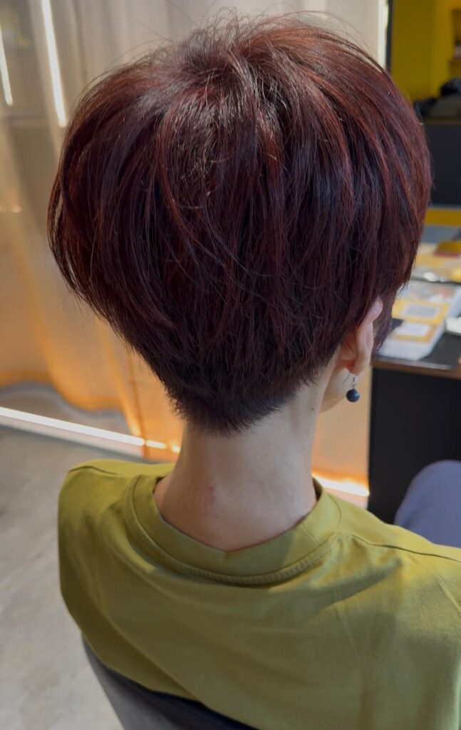Red highlights for grey blending with short haircut at Colors Japanese Hair Salon Singapore near Clarke Quay and Chinatown creating warmth and natural dimension