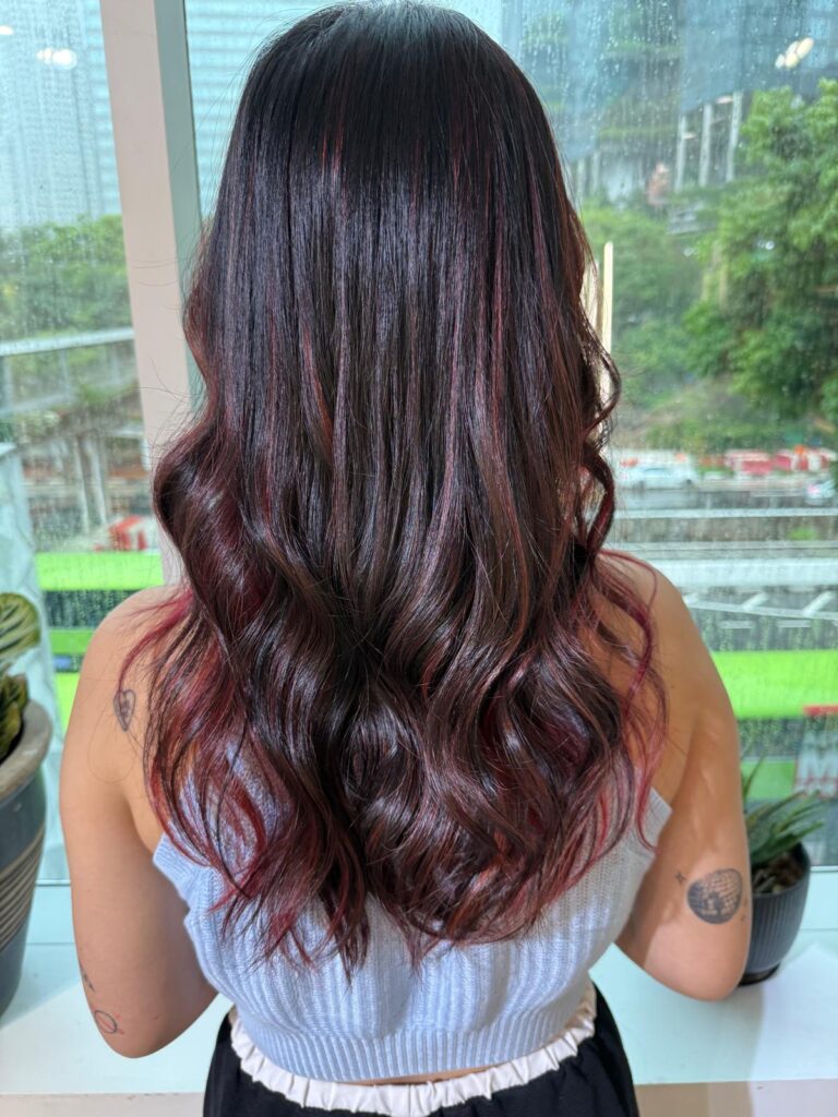 Red Highlights for Long Hair Singapore | Japanese Hair Salon Singapore 1 Red highlights long hair Singapore by Colors Japanese Hair Salon Singapore near Clarke Quay MRT, dimensional red highlight hair color for glossy movement
