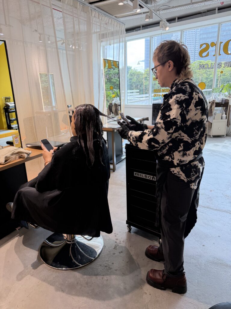 Plex color application for grey hair coverage at Colors Japanese Hair Salon Singapore, performed by junior stylist using Japanese low-damage coloring techniques.
