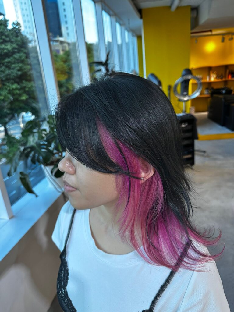 Light purple inner color on black hair with medium wolf cut at Colors Japanese Hair Salon Singapore, plex bleach for low damage and vivid gel color finish