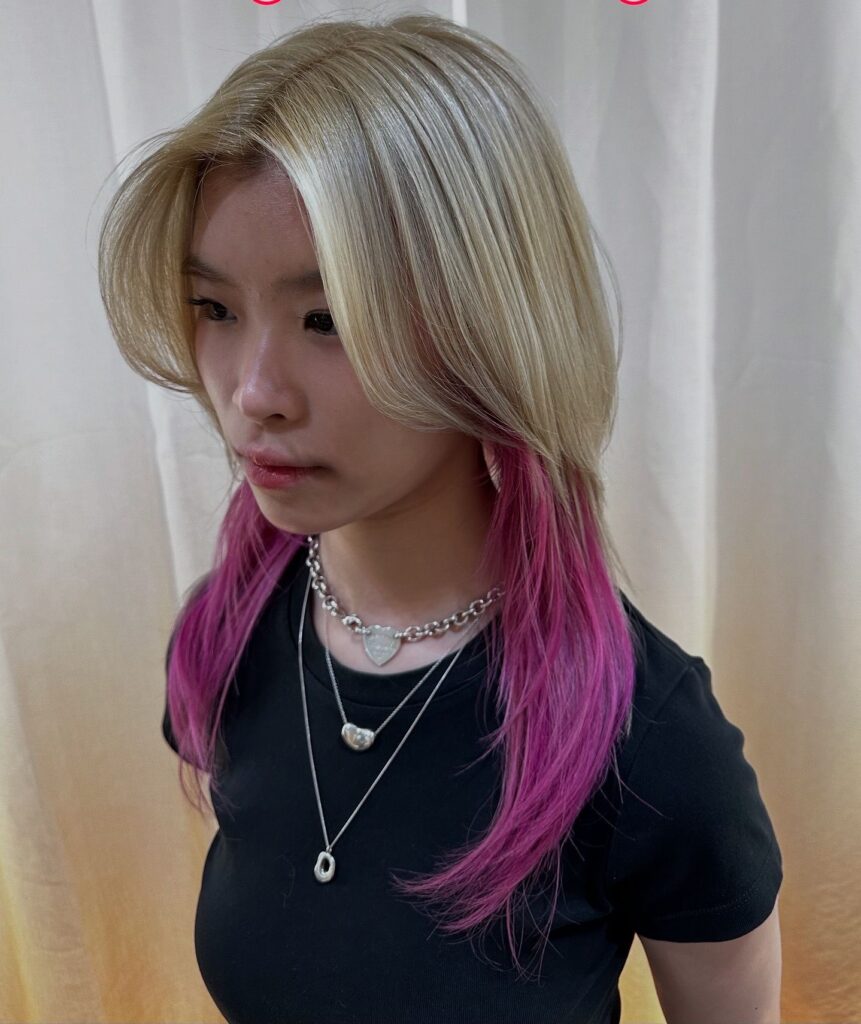 Pink and yellow ash full bleach color at Colors Japanese Hair Salon Singapore, Japanese hair salon near Clarke Quay, low-damage PLEX bleach with medium wolf cut and added volume