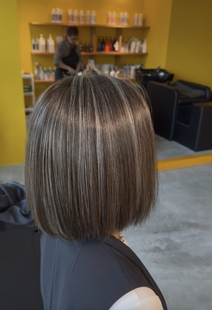 Grey blending ash tone bob haircut at Colors Japanese Hair Salon Singapore, low-maintenance grey hair color for short hair.