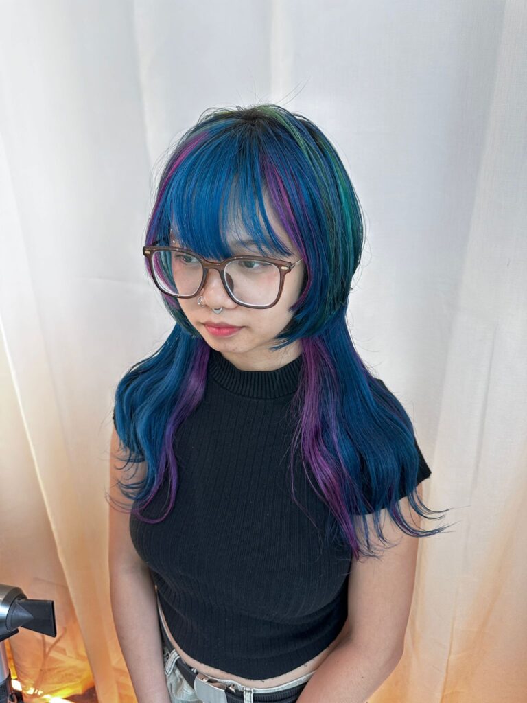 Multi color design hair with blue green and purple on double bleach base, layered haircut with bangs at Japanese hair salon Singapore