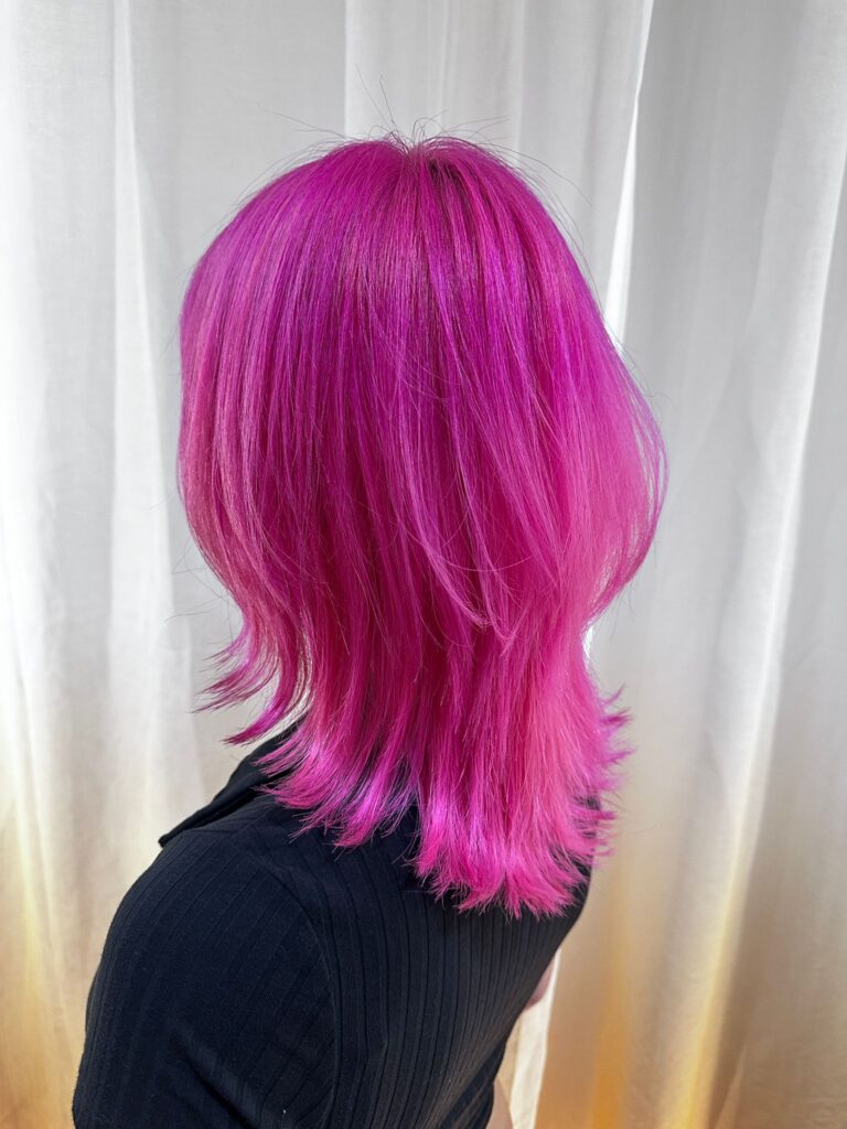 Vivid pink medium layered hair with double bleach and plex care at Japanese Hair Salon Singapore near Clarke Quay and Chinatown.