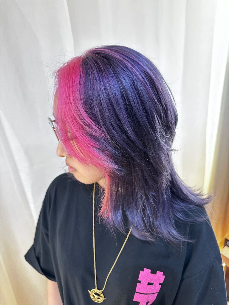 Double bleach vivid light pink and dark purple medium wolf cut at Colors Japanese Hair Salon Singapore near Clarke Quay.
