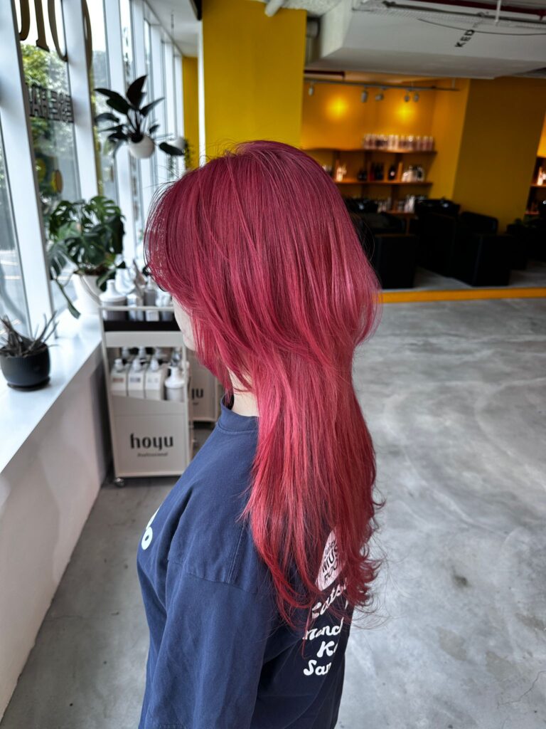 Cherry red long wolf haircut with plex bleach at Japanese Hair Salon Singapore, high layered red design color near Clarke Quay.