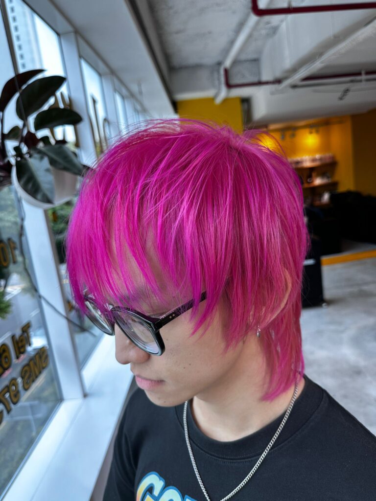 Full bleach vivid pink short hairstyle at Japanese Hair Salon Singapore, bold high-pigment pink color for men and women near Clarke Quay.