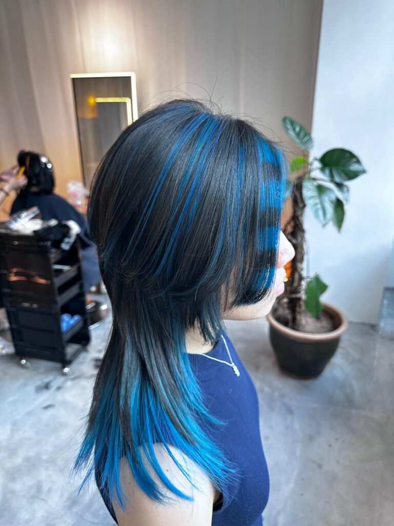 Blue Raccoon Design on Layered Wolf Cut | Japanese Hair Salon Singapore 1 Layered wolf haircut with deep blue raccoon highlights, inner bleach and fringe design at Japanese hair salon Singapore