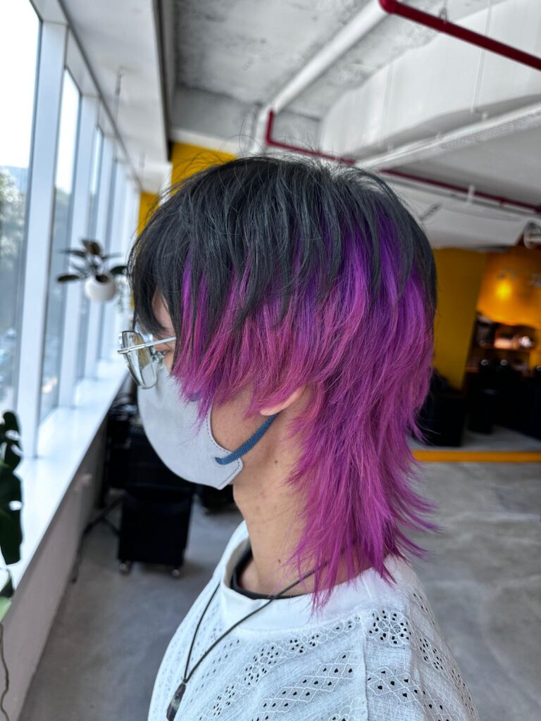 Short layered wolf cut with high inner purple bleach color, natural black surface, unisex style at Japanese hair salon Singapore