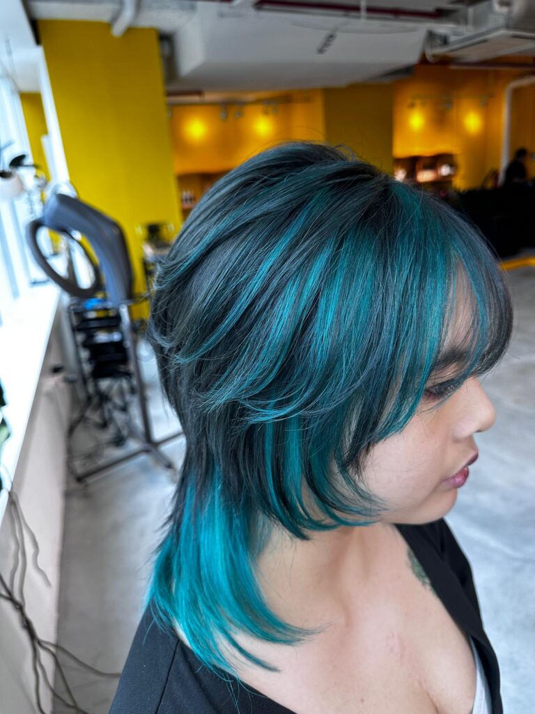 Emerald green inner color with highlights on wolf cut at Japanese hair salon Singapore near Clarke Quay and Chinatown