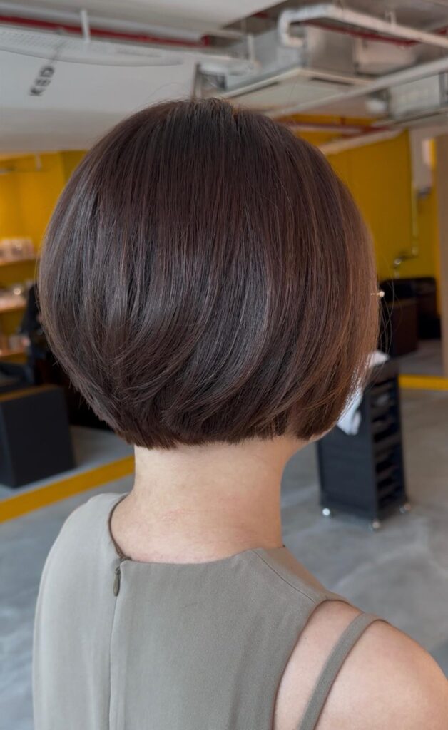 Grey coverage brown hair color with bob haircut and keratin treatment at Colors Japanese Hair Salon Singapore near Clarke Quay creating smooth shine and frizz control