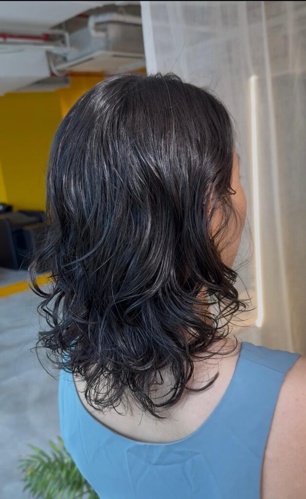 Digital perm with layered haircut creating natural volume and soft waves at Colors Japanese Hair Salon Singapore near Clarke Quay and Chinatown