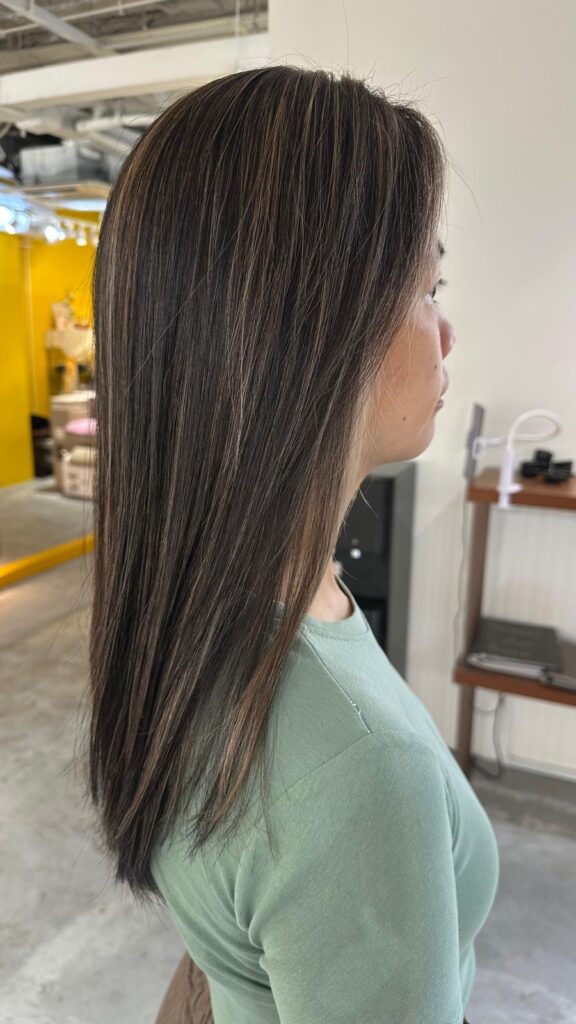 Beige bleach highlights long hair with natural dimension at Japanese Hair Salon Singapore near Clarke Quay Chinatown creating brightness and soft movement
