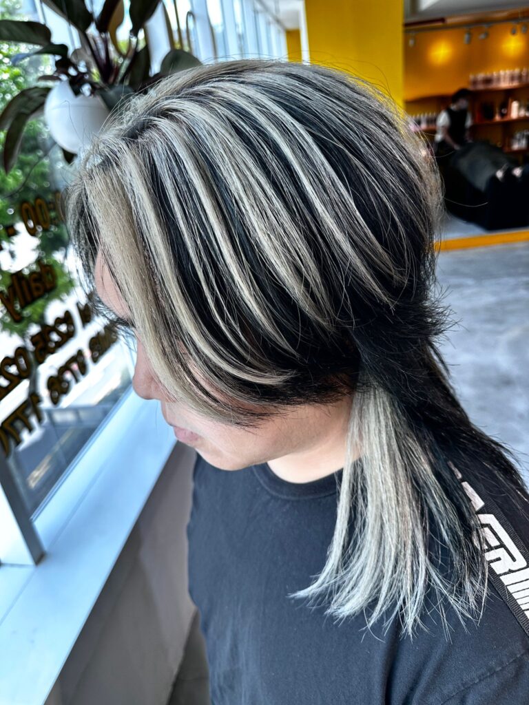 White blonde highlight design with surface highlights and inner color created using bleach and plex treatment by Creative Manager Issey at Colors Japanese Hair Salon Singapore near Clarke Quay Chinatown Singapore