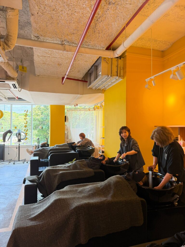 Flat reclining shampoo chairs relaxing head spa experience at Japanese Hair Salon Singapore near Clarke Quay Chinatown comfortable salon shampoo bed Singapore