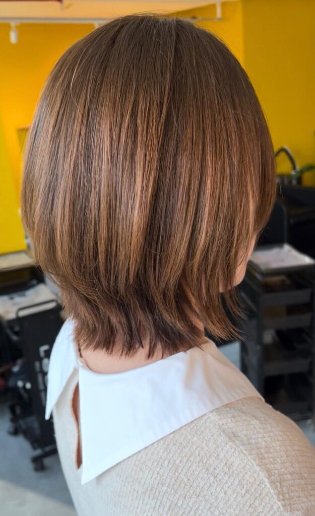 Natural layer short hair with light brown plex color without bleach at Japanese Hair Salon Singapore near Clarke Quay Chinatown creating movement and soft texture