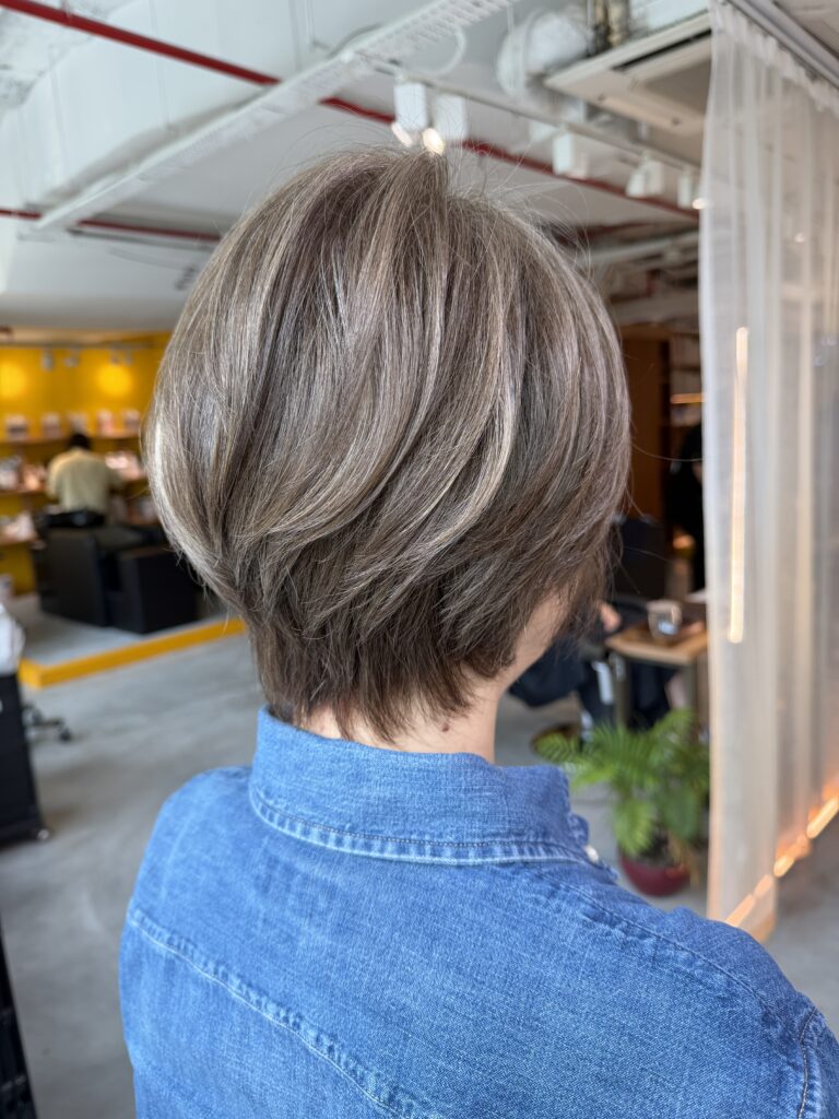 Grey Blending Short Hair Singapore | Japanese Hair Salon Singapore 1 Grey blending short hair with low damage bleach highlights at Colors Japanese Hair Salon Singapore near Clarke Quay. Natural silver highlights blended with dark base color for soft grey coverage and easy maintenance short hairstyle.
