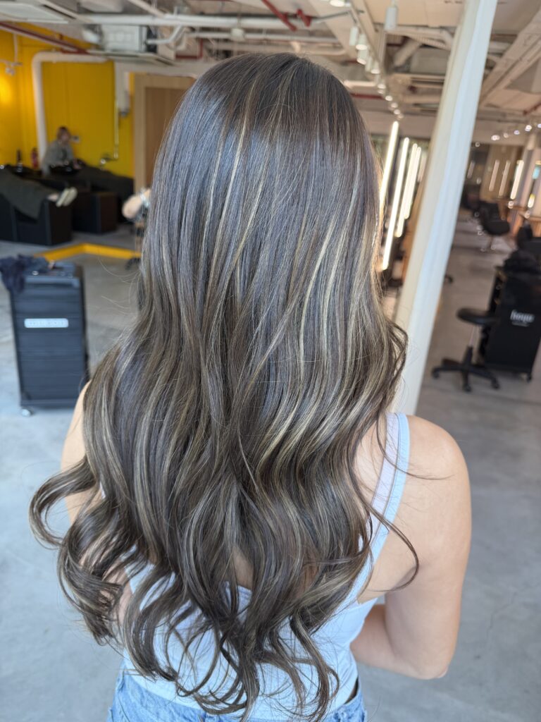 Beige Gold Highlight Long Hair Singapore | Japanese Hair Salon Singapore 1 Long hair beige gold highlights in Singapore with blended bleach highlights and soft face-framing layers, creating dimension, movement, and a natural sun-kissed finish at a Japanese hair salon.