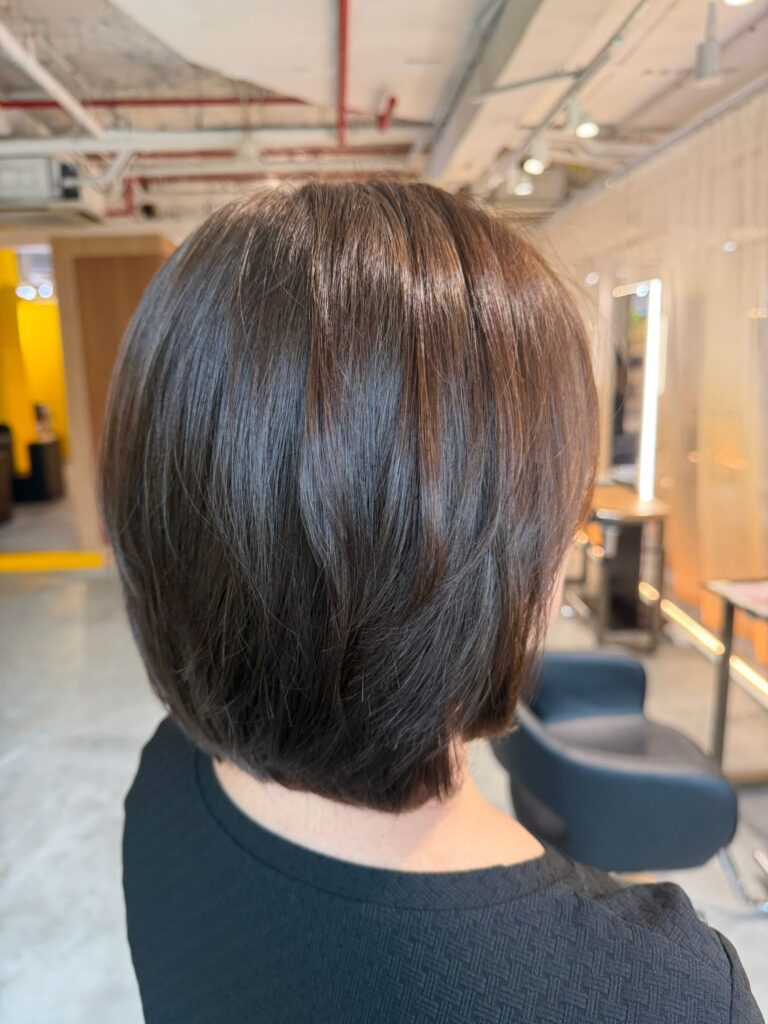 Soft brown grey coverage hair color with natural shine and low-maintenance regrowth by Colorist Ura at Colors Japanese Hair Salon Singapore.