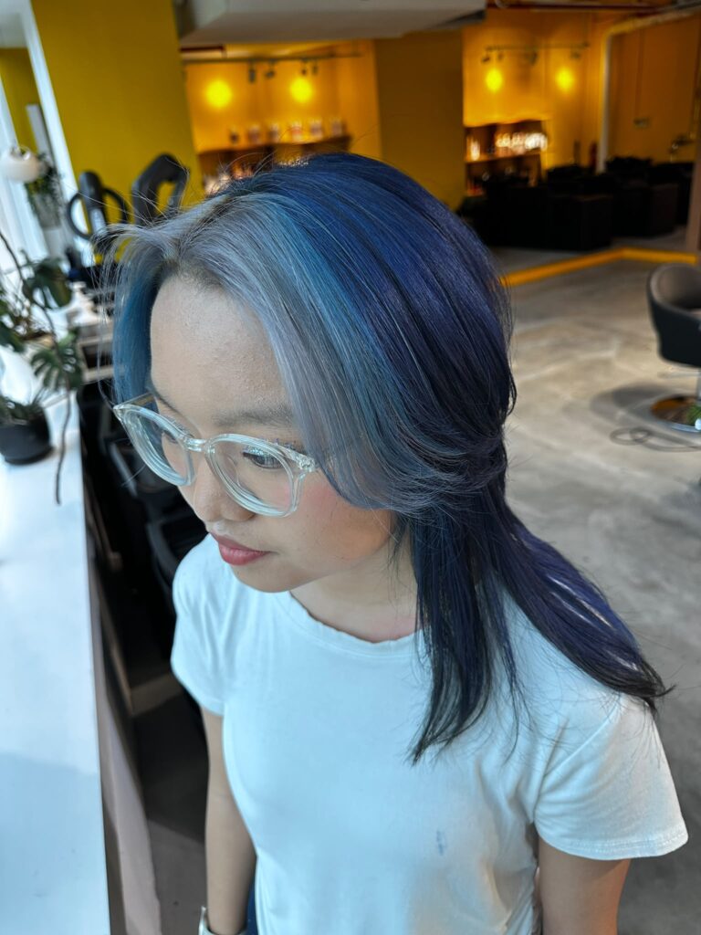 Wolf Medium Face Framing Blue Design Color Singapore | Japanese Hair Salon 1 Blue face-framing highlights with low-damage Plex bleach by Stylist Issey at Colors Japanese Hair Salon Singapore, featuring vibrant blue and light blue fashion color.