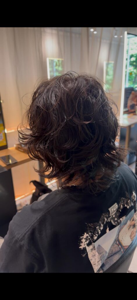 Japanese medium wolf perm by Stylist Sylvia at Colors Japanese Hair Salon Singapore, creating natural texture, movement, and effortless styling.