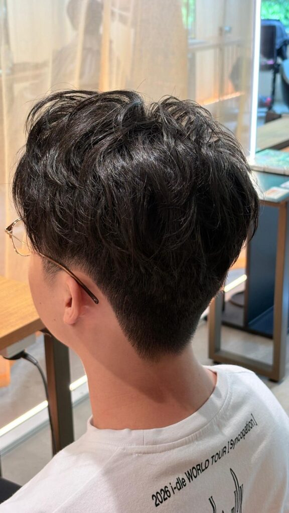 Men’s Short Top Perm Singapore | Japanese Hair Salon Singapore 1 Japanese men's short perm with clean fade and natural texture by Stylist Andy at Colors Japanese Hair Salon Singapore.