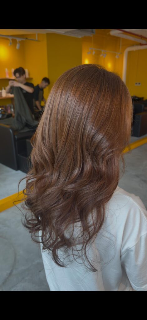 Long layered hairstyle with Plex Ash Brown hair color by Stylist Sylvia at Colors Japanese Hair Salon Singapore, creating soft movement, shine, and a healthy low-damage finish.