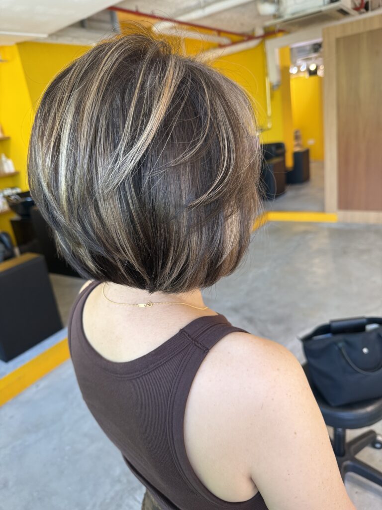 Grey blending highlights bob with soft natural grey coverage and low-damage plex bleach by Stylist Satsuki and Colorist Ura at Colors Japanese Hair Salon Singapore.