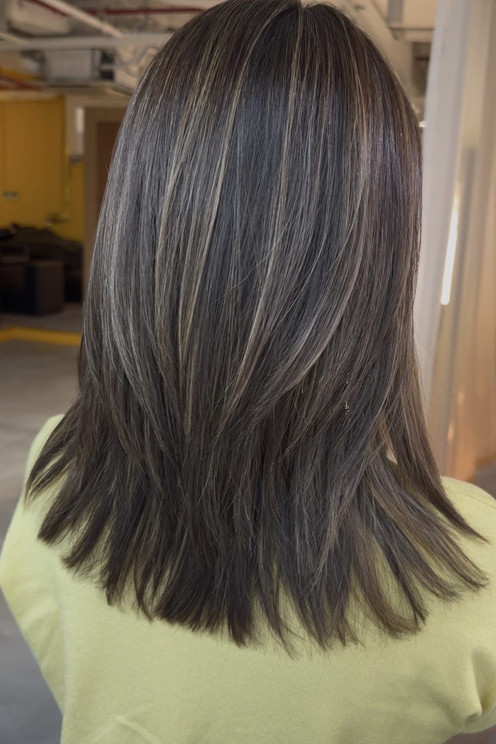 Medium layered haircut with grey blending highlights in soft gold beige at a Japanese Hair Salon Singapore. Plex Color helps minimize damage while blending grey hair naturally with a dimensional, healthy-looking finish.