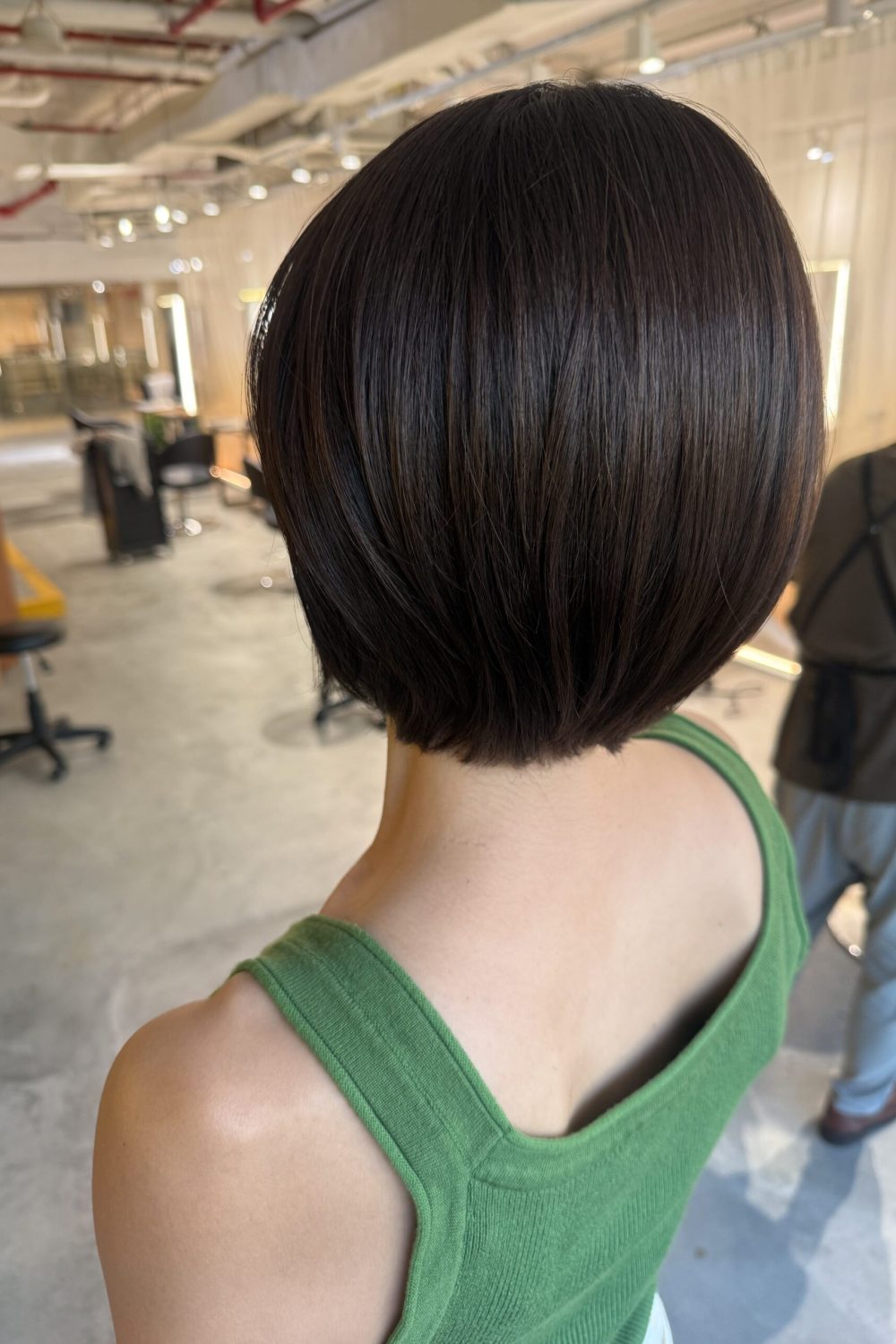 Compact bob haircut with cool brown grey coverage at Japanese Hair Salon Singapore. Bright grey hair color using low-damage Plex Color and BYKARTE treatment for healthy, smooth, naturally rounded hair.