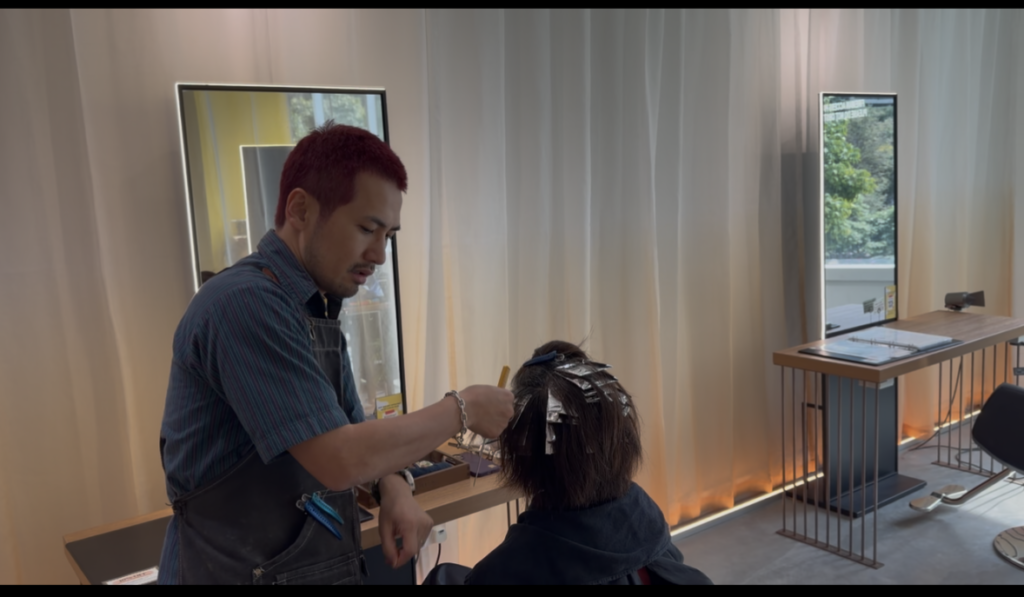 Grey blending highlights work in progress by Colorist Ura at a Japanese hair salon in Singapore near Clarke Quay MRT, micro-section highlights to blend white hair naturally, low-damage glossy finish.