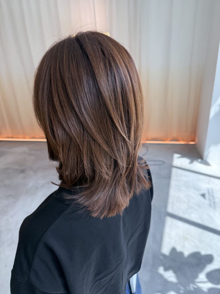 Grey blending copper brown hair color with medium layers at Colors Japanese Hair Salon Singapore near Clarke Quay