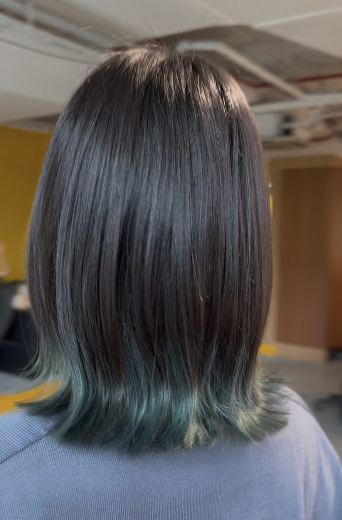 Inner bleach blue-green hair color on a flipped bob at Colors Japanese Hair Salon Singapore near Clarke Quay MRT—low-damage Japanese inner color / fashion color technique with a subtle hidden accent in Singapore.