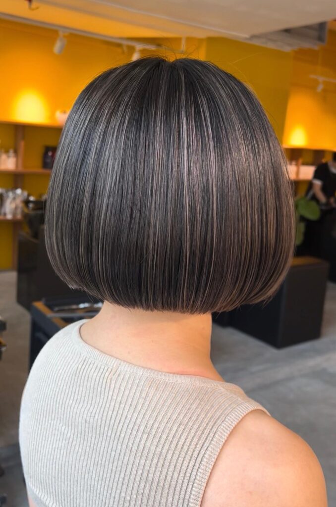Grey silver highlight bob haircut with low-damage bleach highlights at Colors Japanese Hair Salon Singapore near Clarke Quay and Chinatown by Stylist Satsuki and Colorist Ura