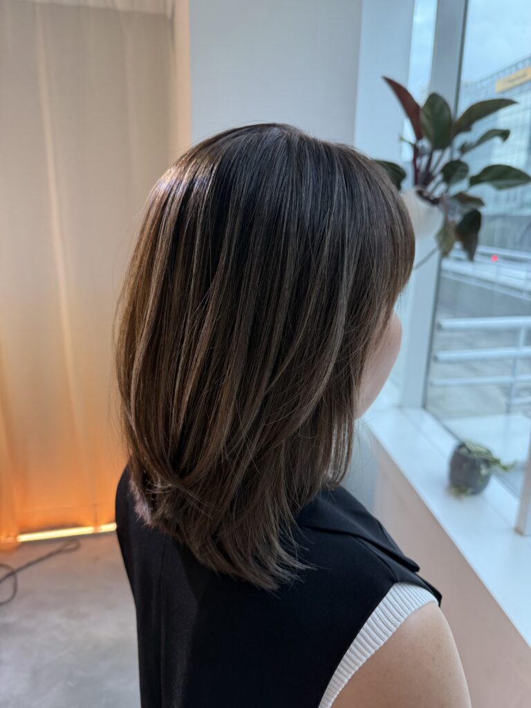 Layered haircut with fine highlights at Colors Japanese Hair Salon Singapore near Clarke Quay MRT, low-damage bleach highlight and soft grey blending Singapore technique