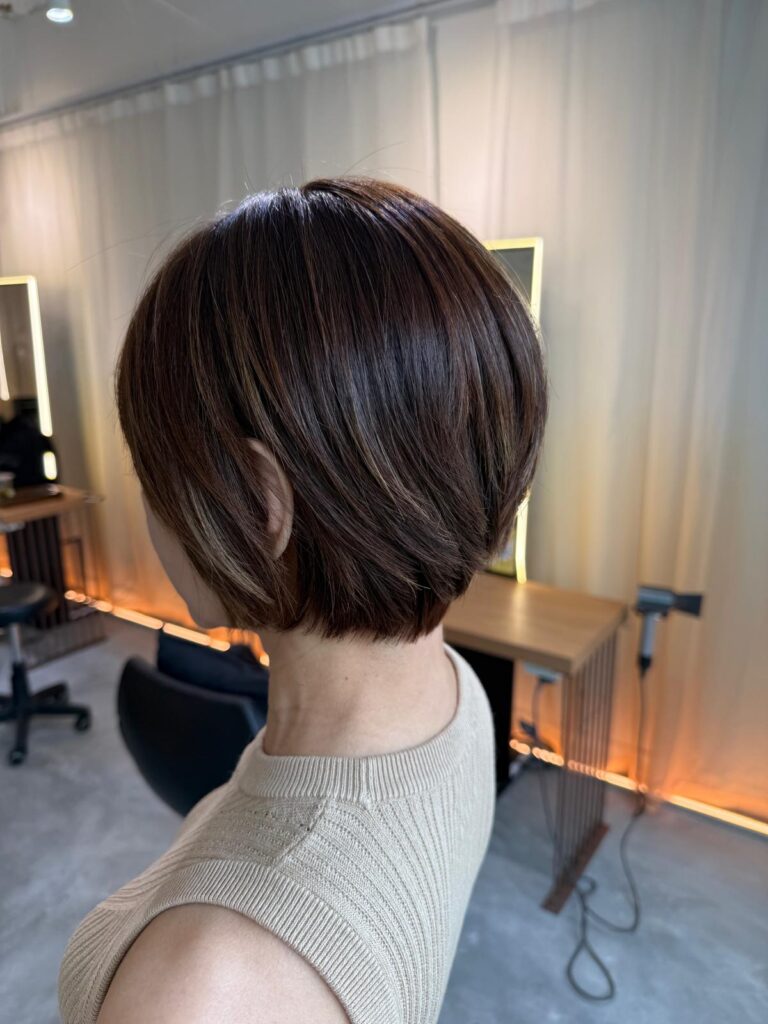 Grey coverage light brown hair color with short haircut at Colors Japanese Hair Salon Singapore near Clarke Quay creating soft natural white hair blending