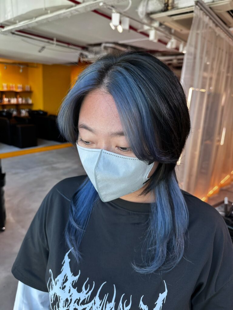 Medium Layer Wolf Cut & Blue Face-Framing Bleach Design | Japanese Hair Salon Singapore 1 Medium Layer Wolf Cut with Blue Face-Framing Bleach Design at Japanese Hair Salon Singapore. Plex bleach, dark ash base color, blue highlights around the face and nape.