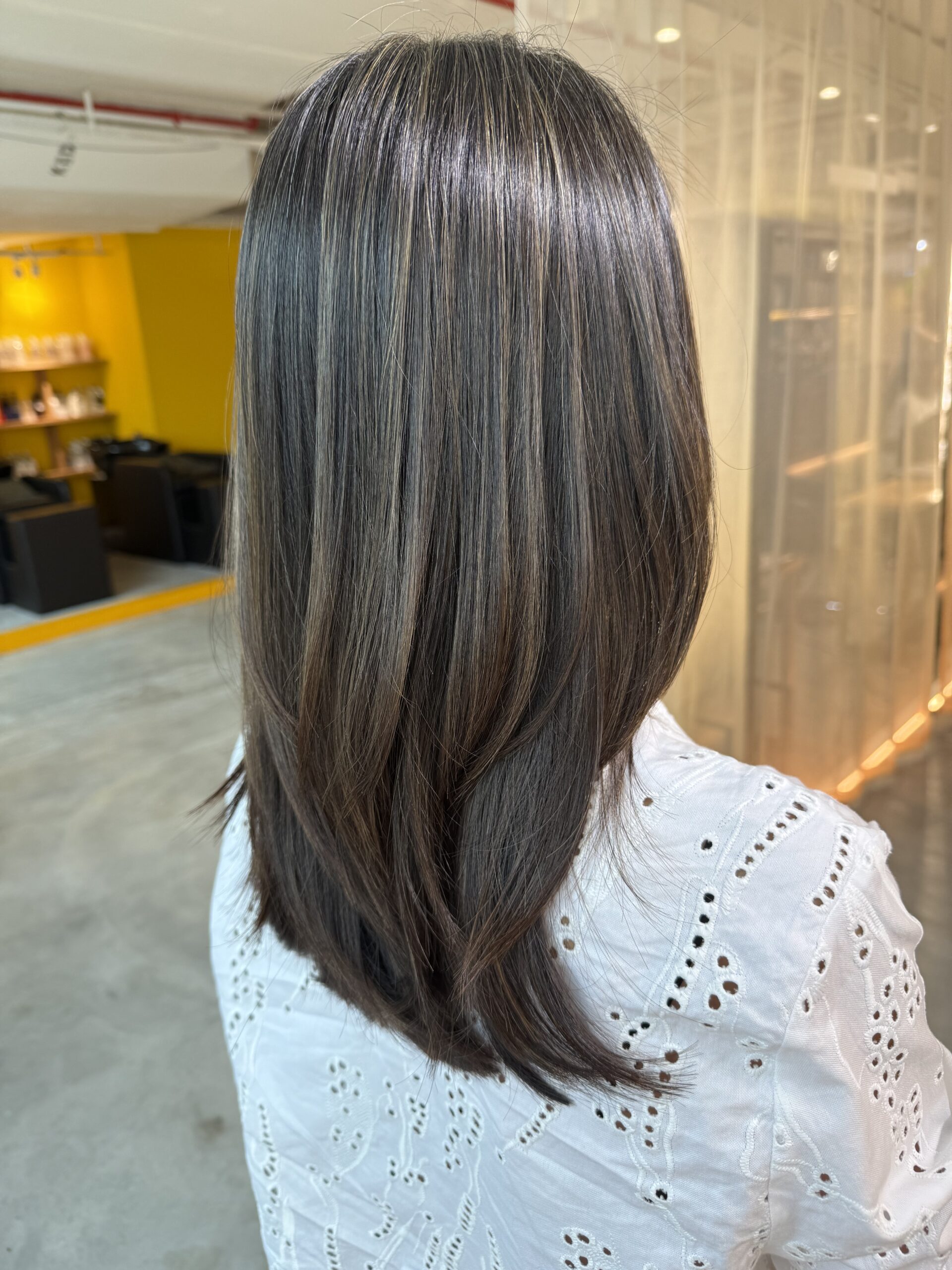 Low-layer grey blending Singapore created with bleach highlights by Colorist Ura and Stylist Satsuki at Colors Japanese Hair Salon Singapore
