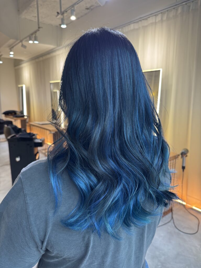 Blue wave hair color with soft movement created by Colorist Ura and styled by Stylist Satsuki using Japanese low-damage bleach techniques at a Japanese hair salon in Singapore