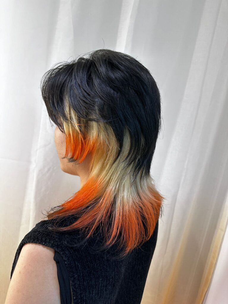 Orange and yellow bleach design wolf cut with short top, created by Stylist Issey at a Japanese hair salon in Singapore