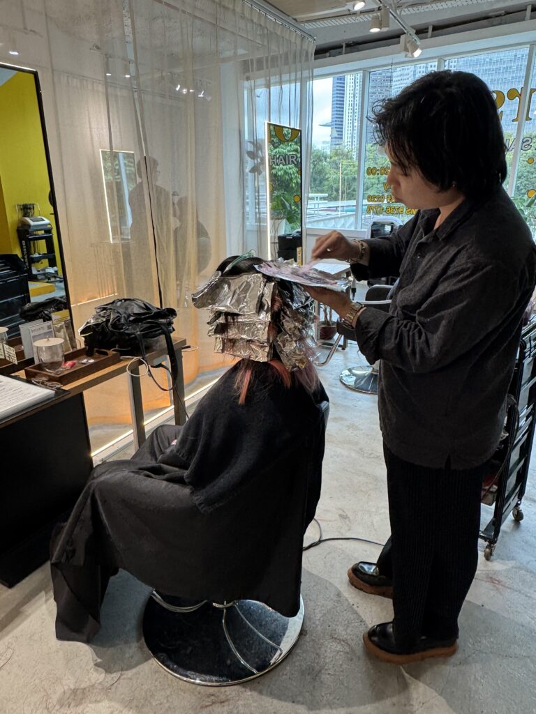 Air touch bleach and natural gradation technique by Andy at Colors Japanese Hair Salon Singapore near Clarke Quay and Chinatown, creating soft blend and refined highlights.