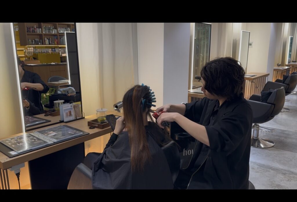 Japanese premium straight perm technique at Colors Japanese Hair Salon Singapore near Clarke Quay and Havelock Road, delivering smooth, natural-looking straight hair with shine.