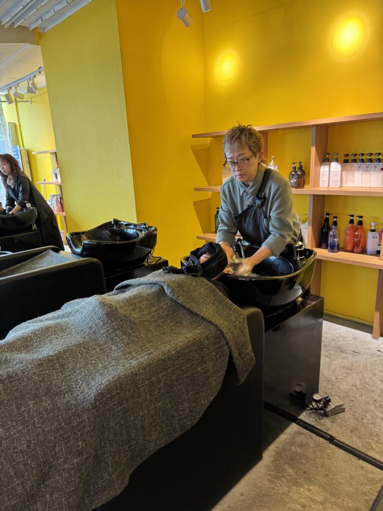 Relaxing Japanese shampoo and treatment service at Colors Japanese Hair Salon Singapore near Clarke Quay and Havelock Road, creating a calm salon experience and healthy hair condition.