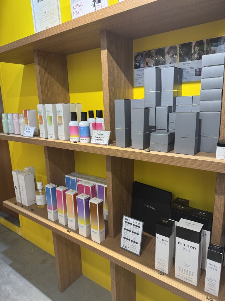 Japanese professional hair care products display at Colors Japanese Hair Salon Singapore near Clarke Quay and Havelock Road, featuring Hoyu and Milbon for color care and scalp care.