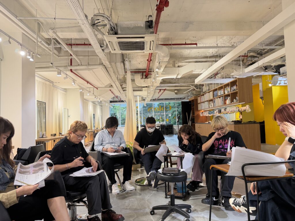 In-house technical training on Japanese hair straightening and chemical knowledge at Colors Japanese Hair Salon Singapore, focusing on damage control, rebonding formulas, and consistent results