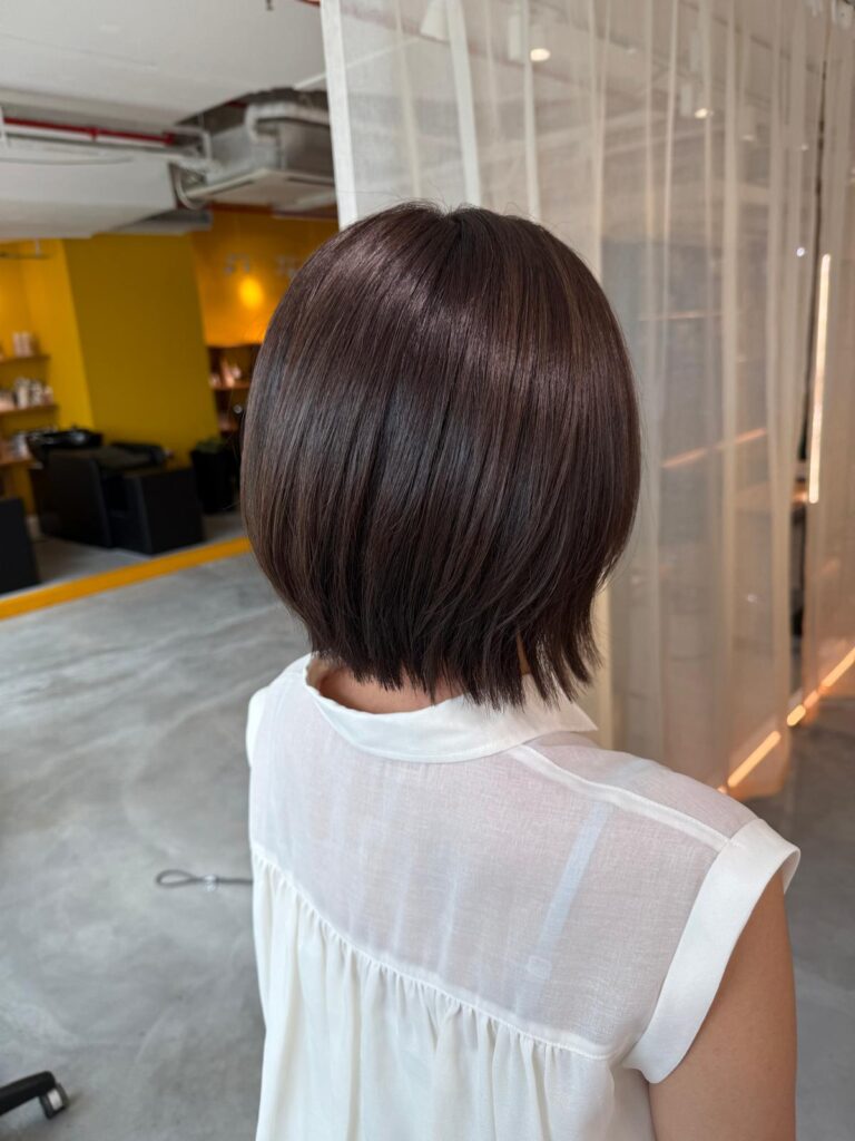 White hair coverage brown hair color with bob haircut at Colors Japanese Hair Salon Singapore near Clarke Quay creating natural grey coverage and soft bob silhouette