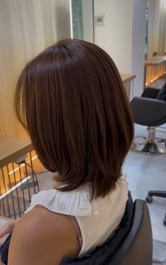 Medium Natural Layer Brown Grey Coverage | Japanese Hair Salon Singapore 1 Natural layered haircut with warm brown plex color at Colors Japanese Hair Salon Singapore near Clarke Quay and Chinatown creating soft movement and healthy shine